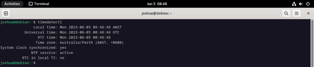 Screenshot showing the usage of the timedatectl command on Debian Linux.