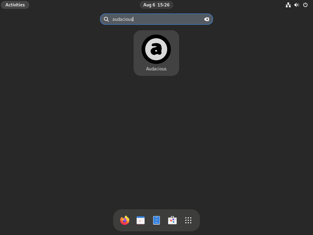 Clicking on the Audacious icon from the "Show Applications" menu in Fedora Linux.